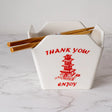 Everything tastes better in a to-go container…but this one is designed to be reusable

Bowl Size: 5" Dia x 4"H
Chopsticks 9"L
Capacity: 16 fl oz
Material: Ceramic
Microwave and Dishwasher Safe
Origin: China