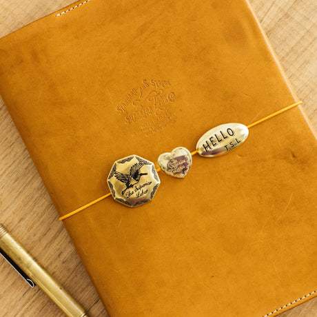 The SUPERIOR LABOR Brass Concho is a stylish, functional accessory designed to add a touch of flair to everyday life. Crafted from solid brass, it is available in multiple designs including circle, star, oval, and heart.