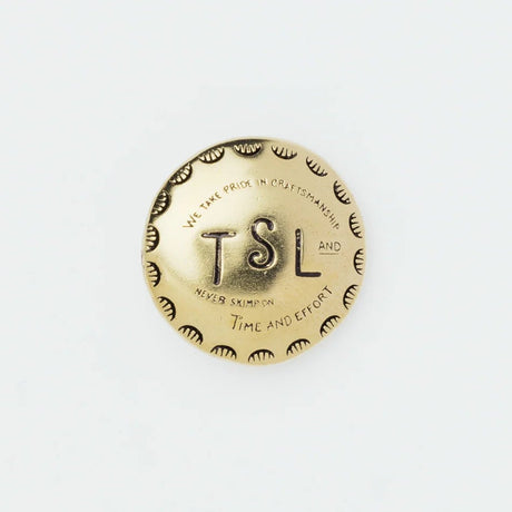 The SUPERIOR LABOR Brass Concho is a stylish, functional accessory designed to add a touch of flair to everyday life. Crafted from solid brass, it is available in multiple designs including circle, star, oval, and heart.