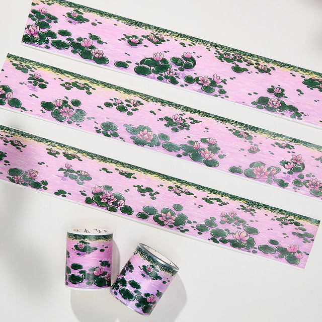 Immerse yourself in the serenity of dusk with the Lotus Silhouette Washi/PET Tape. This tape captures the quietest moment on the pond, right as the sun dips below the horizon. The design features elegant lotuses floating on calm water, their usual bright colors softened into a deep, romantic pink by the fading sunset light. These aren't just flowers; they are reflections of the sky, "blushing" in the twilight.