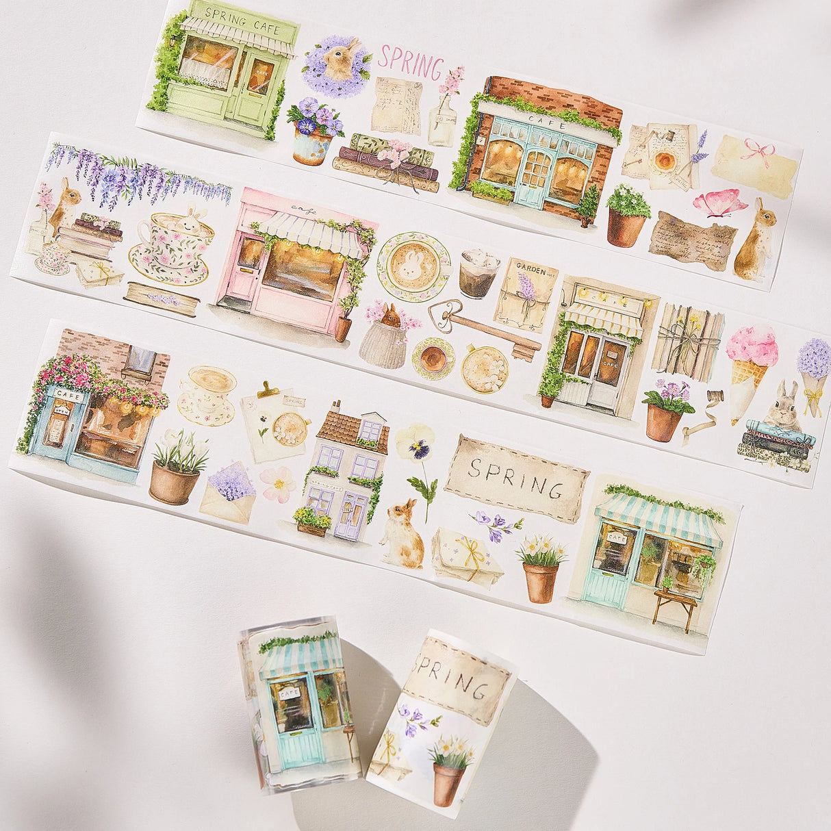 Celebrate the season of new beginnings with a design that marries architecture and nature. Our Spring Café Wide Tape is a watercolor love letter to the season, featuring quaint cafe facades almost hidden behind explosions of pastel bouquets and greenery.