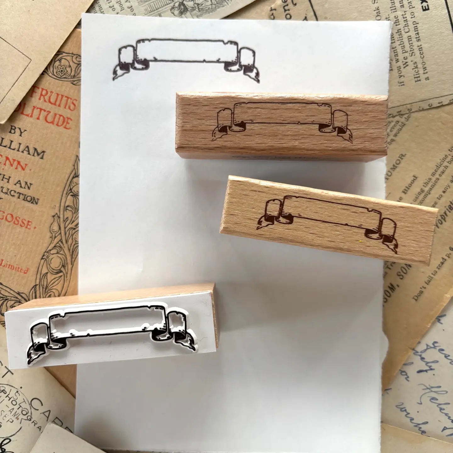 One rubber stamp of a banner! Use this for anywhere you need a fancy label for something.

Each stamp is made with beech wood and measures roughly 1.5L x .625W x .8H" (63x18x20mm). The stamp impression is 50mm wide, and the writable area on the scroll is 34mm wide.
