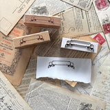 One rubber stamp of a banner! Use this for anywhere you need a fancy label for something.

Each stamp is made with beech wood and measures roughly 1.5L x .625W x .8H" (63x18x20mm). The stamp impression is 50mm wide, and the writable area on the scroll is 34mm wide.