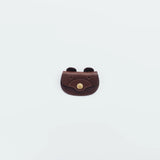 A coin purse with a bear&nbsp;motif.

It is small enough to carry in your pocket when you are out and about. Compact and sturdy, it can be used for many years and has a cute design that adds a nice accent to its appearance.

Size: W11×H6.5cm
Leather Products
We use natural leather. While we avoid pieces with damage that could cause tearing, natural marks, wrinkles, and other characteristics are part of the leather’s charm and may be present on the product. Even within the same type of leather, color, thickn