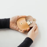 A coin purse with a bear&nbsp;motif.

It is small enough to carry in your pocket when you are out and about. Compact and sturdy, it can be used for many years and has a cute design that adds a nice accent to its appearance.

Size: W11×H6.5cm
Leather Products
We use natural leather. While we avoid pieces with damage that could cause tearing, natural marks, wrinkles, and other characteristics are part of the leather’s charm and may be present on the product. Even within the same type of leather, color, thickn