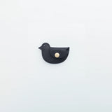 A coin purse with a bird motif.

It is small enough to carry in your pocket when you are out and about. Compact and sturdy, it can be used for many years and has a cute design that adds a nice accent to its appearance.

Size: W11×H6.5cm
Leather Products
We use natural leather. While we avoid pieces with damage that could cause tearing, natural marks, wrinkles, and other characteristics are part of the leather’s charm and may be present on the product. Even within the same type of leather, color, thickness, 