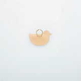 A coin purse with a bird motif.

It is small enough to carry in your pocket when you are out and about. Compact and sturdy, it can be used for many years and has a cute design that adds a nice accent to its appearance.

Size: W11×H6.5cm
Leather Products
We use natural leather. While we avoid pieces with damage that could cause tearing, natural marks, wrinkles, and other characteristics are part of the leather’s charm and may be present on the product. Even within the same type of leather, color, thickness, 