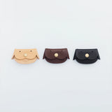 A coin purse with a dog motif.

It is small enough to carry in your pocket when you are out and about. Compact and sturdy, it can be used for many years, and the design is cute and makes a nice accent.