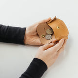 A coin purse with a dog motif.

It is small enough to carry in your pocket when you are out and about. Compact and sturdy, it can be used for many years, and the design is cute and makes a nice accent.
