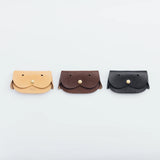 A wallet with a dog motif.

It is durable and can be used for many years, and the design is cute and makes a nice accent.