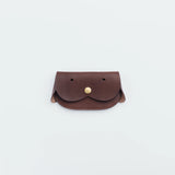 A wallet with a dog motif.

It is durable and can be used for many years, and the design is cute and makes a nice accent.