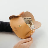 A wallet with a dog motif.

It is durable and can be used for many years, and the design is cute and makes a nice accent.