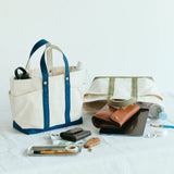 The SUPERIOR LABOR Mini Tote Bag

A simple, timeless canvas bag designed for everyday life.

Its compact size is just right for daily essentials, while the four outer pockets keep your glasses, keys, favorite pens, or notebook neatly organized.

They make it easy to stay tidy and add a touch of extra storage without changing the clean look of the bag.

Size: W37×H23.5×D12.5cm
Canvas Products
Painted areas may be affected by friction or water, which can cause color transfer. Please handle with care.