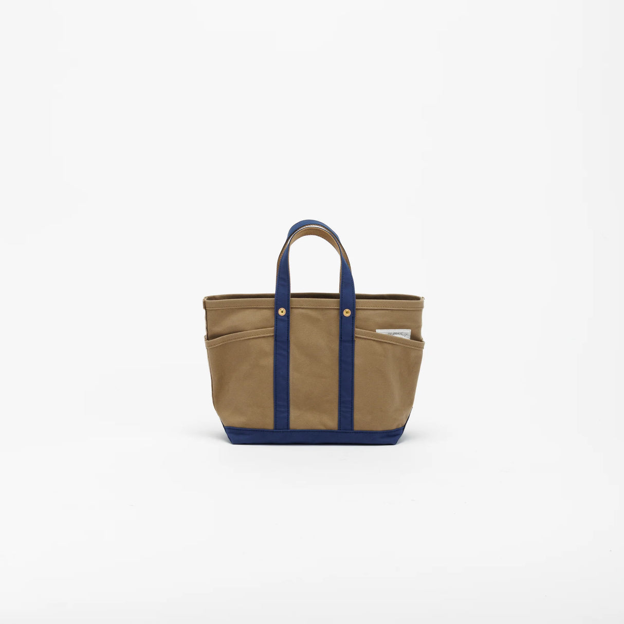 The SUPERIOR LABOR Mini Tote Bag

A simple, timeless canvas bag designed for everyday life.

Its compact size is just right for daily essentials, while the four outer pockets keep your glasses, keys, favorite pens, or notebook neatly organized.

They make it easy to stay tidy and add a touch of extra storage without changing the clean look of the bag.

Size: W37×H23.5×D12.5cm
Canvas Products
Painted areas may be affected by friction or water, which can cause color transfer. Please handle with care.