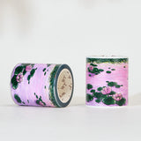 Immerse yourself in the serenity of dusk with the Lotus Silhouette Washi/PET Tape. This tape captures the quietest moment on the pond, right as the sun dips below the horizon. The design features elegant lotuses floating on calm water, their usual bright colors softened into a deep, romantic pink by the fading sunset light. These aren't just flowers; they are reflections of the sky, "blushing" in the twilight.