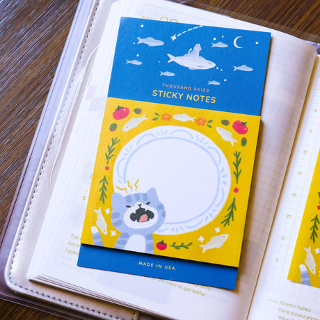 Full color sticky notes featuring a cute kitty meowing in front of a plate surrounded by sardines!

3x3 inches
25 sheets
Printed with 3M