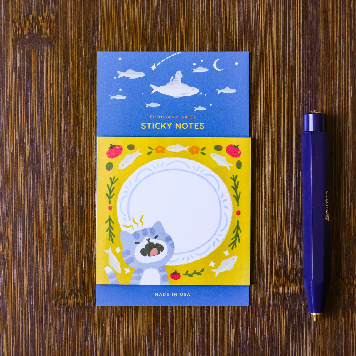 Full color sticky notes featuring a cute kitty meowing in front of a plate surrounded by sardines!

3x3 inches
25 sheets
Printed with 3M