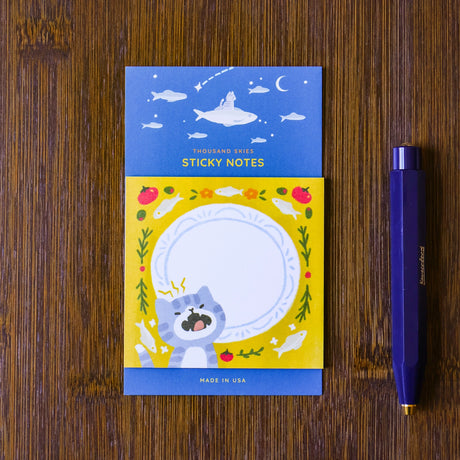 Full color sticky notes featuring a cute kitty meowing in front of a plate surrounded by sardines!

3x3 inches
25 sheets
Printed with 3M