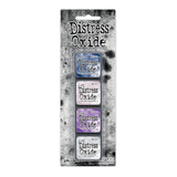 Tim Holtz Distress Mini Oxide Ink Pads are a collection of 1 x 1 cubes featuring water-reactive dye &  pigment ink fusion that creates an oxidized effect when sprayed with water.