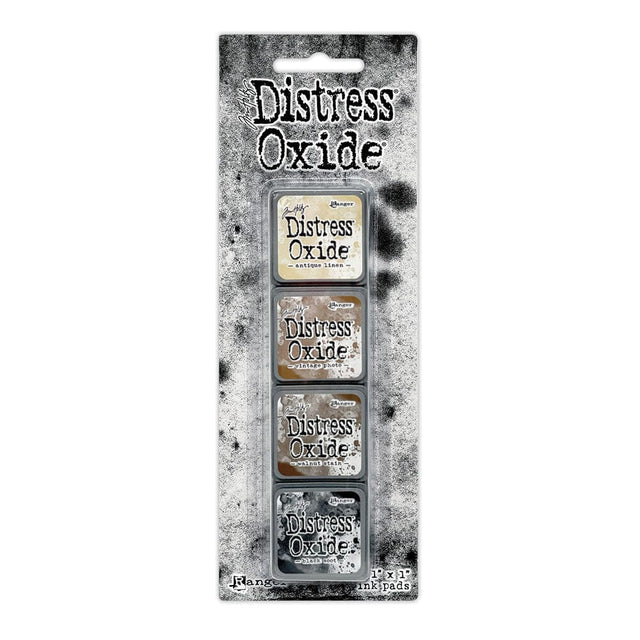Tim Holtz Distress Mini Oxide Ink Pads are a collection of 1 x 1 cubes featuring water-reactive dye & pigment ink fusion that creates an oxidized effect when sprayed with water.