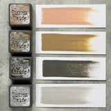Tim Holtz Distress Mini Oxide Ink Pads are a collection of 1 x 1 cubes featuring water-reactive dye & pigment ink fusion that creates an oxidized effect when sprayed with water.