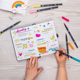 Set of 6 colors. Dual Brush Pens feature a flexible brush tip and a fine tip in one marker. The brush tip works like a paintbrush to create fine, medium, or bold strokes, while the fine tip provides consistent lines. The Happy Hour palette is inspired by vibrant cocktails and lively gatherings, with bright, playful colors that bring energy to any project. The water-based ink is blendable, and the resilient nylon brush retains its point stroke after stroke.