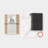 To commemorate this 20th anniversary, we’ve created a new size of TRAVELER’S notebook.

It is TRAVELER’S notebook Card Size. This TRAVELER’S notebook is always with you, even in your daily life. Whether it’s a sudden idea, information you learned or overheard, or something important you don’t want to forget— whenever and wherever you feel like writing, you can quickly grab the notebook and jot it down.

This set includes TRAVELER’S notebook Card Size, Refill Notebooks, Cotton Zipper Case, Kraft Paper Folder