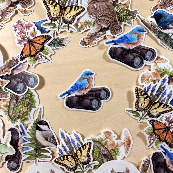 Pegatina de vinilo con pájaro azul oriental sobre binoculares 