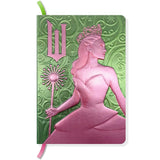 The perfect place to note your thoughts in style, this 184-page collectible journal is a stylish gift for any Wicked fan. This reversible journal can be flipped to present either Elphaba Thropp’s or Glinda Upland’s profiles, with internal pages in soft shades of green and pink and with a satin placeholder ribbon.

QUALITY CONSTRUCTION: This journal features a stunningly detailed, molded hardcover with metallic finish, 184-ruled pages of premium paper, plus a satin ribbon marker to ensure you never lose your