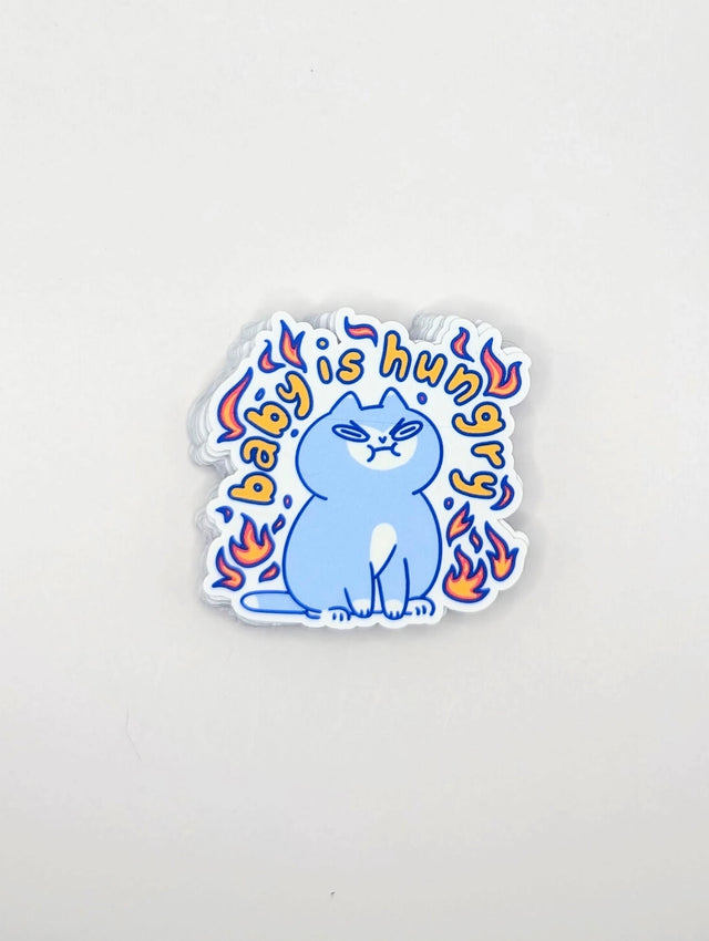 Perfect for those who understand the power of a hangry kitty, this 2" sticker features an adorably angry cat surrounded by vibrant flames. Made from durable, waterproof vinyl, this sticker is built to withstand the elements—whether you stick it on your water bottle, laptop, or anywhere else you want to show off your sassy side. Add a touch of attitude and humor to your collection with this cute yet fiery design!