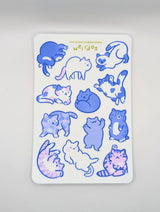 Featuring 12 adorably pudgy cats, each one sporting its own quirky personality, this 4"x6" vinyl sticker sheet is perfect for adding a touch of whimsy to your everyday items. From the cat who’s too cool for school to the one who’s just a little bit offbeat, these weirdos celebrate the joy of being different.