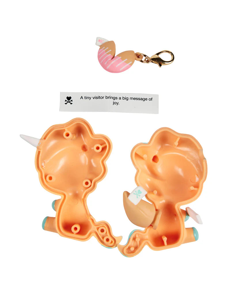 Good vibes and cute surprises are in your future!&nbsp; Each Fortune Cookie Unicorno Blind Box reveals one surprise figure and a special fortune inside!&nbsp; Open to discover which Unicorno destiny has chosen for you!&nbsp; With 9 adorable designs, each Unicorno is filled with sweetness, sparkle, and a touch of good luck!&nbsp; Collect them all and see what fortune awaits!